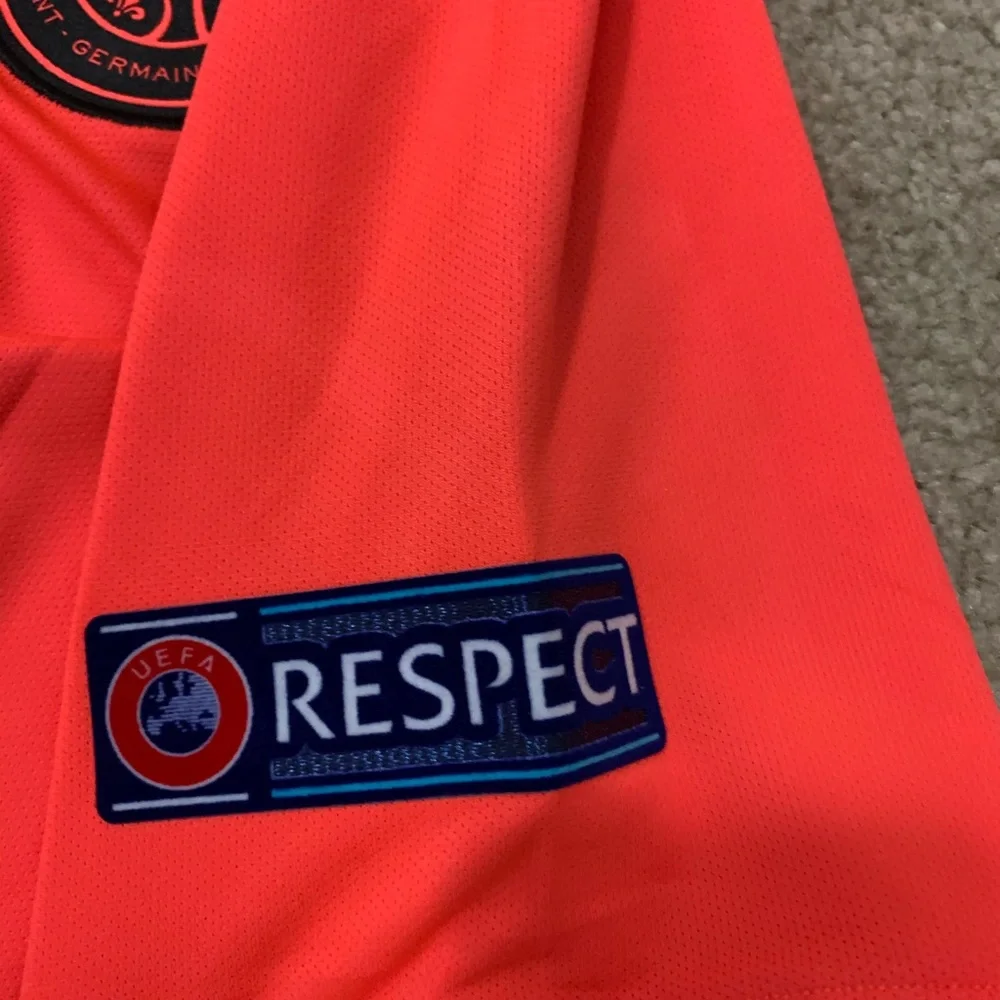 Jordan Men’s Mbappé #7 Short Sleeve Jersey - Neon Coral with Black Accents